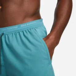 Nike Men's DRI-FIT Stride 7" Shorts (379 - Mineral Teal/Reflective Silver) -Saucony Clothing Shop DM4761 379 PHSYM002